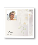 Rouwkaart met orchidee en een eigen foto in wit kader